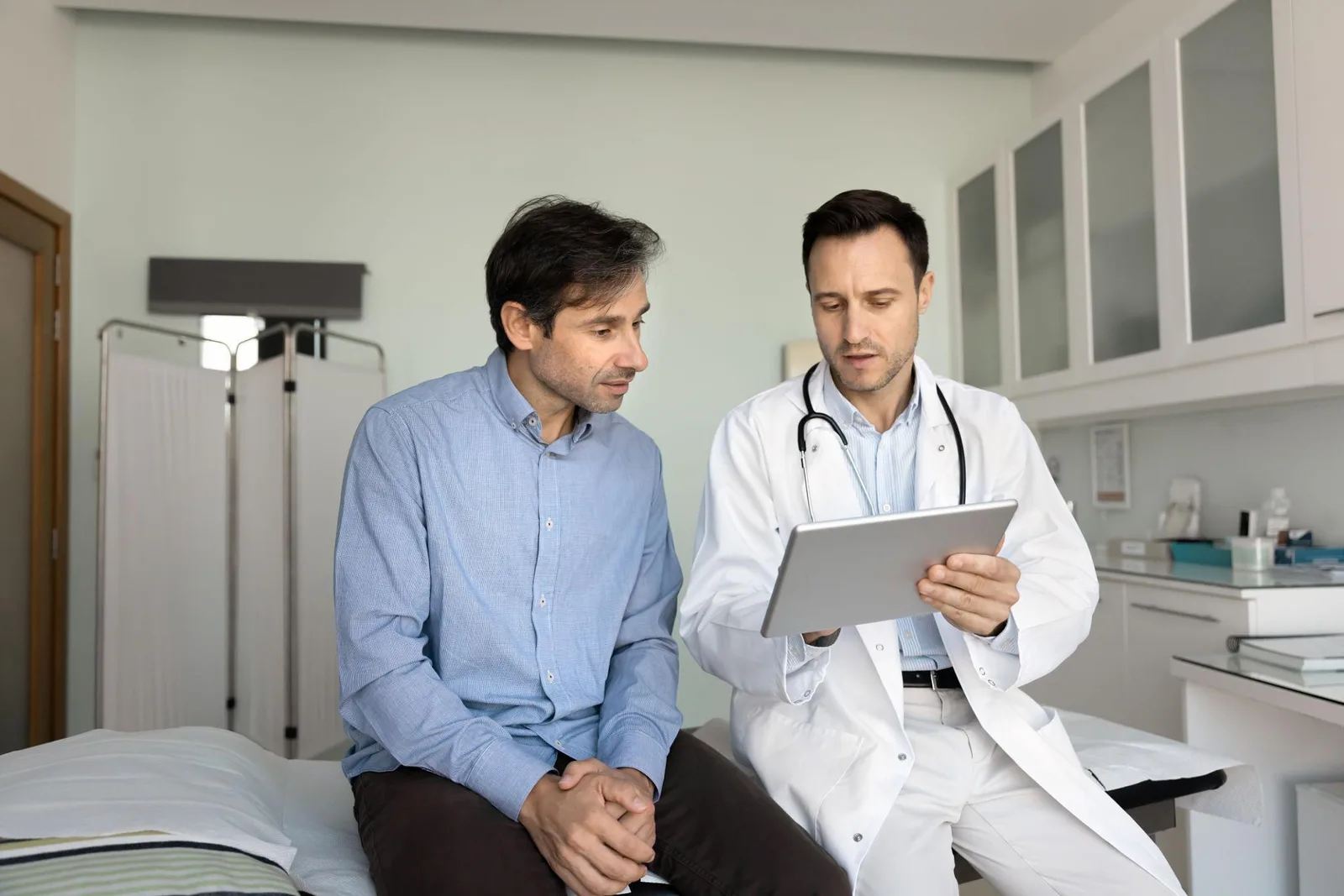 Patient reviewing digital health records on tablet
